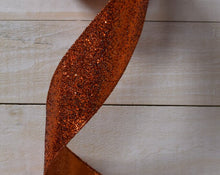 Load image into Gallery viewer, Wired orange glitter ribbon for fall wreaths, crafting, and seasonal decorations, adding sparkle to your autumn creations.
